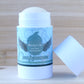 Lavender scented 2.6 ounce, 75 gram deodorant stick in blue label with cap off and cedar background